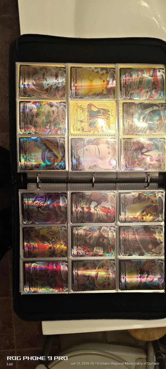 A binder containing holographic Pokémon trading cards, including Pikachu and other characters from the Pokémon series.