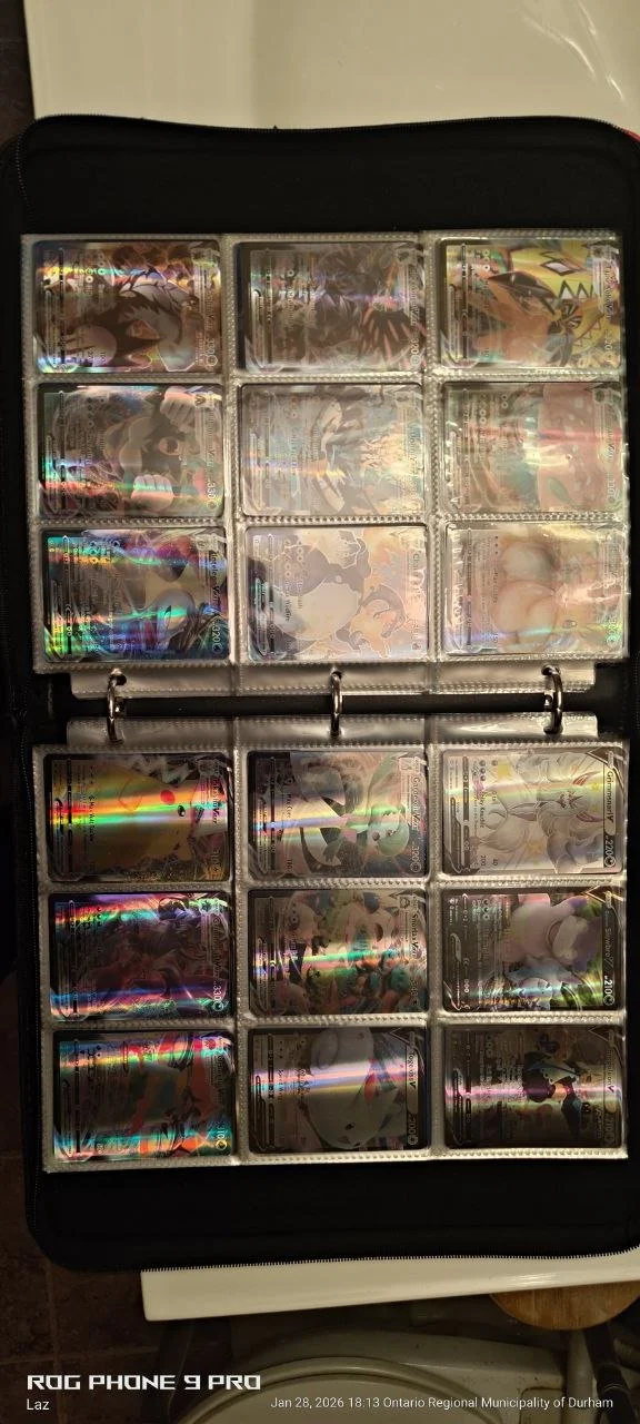 Collection of Pokémon trading cards in a card binder.