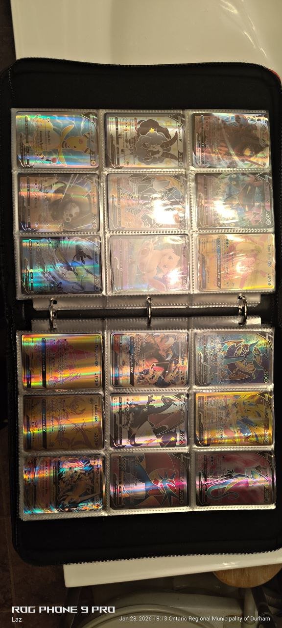 A collection of Pokémon trading cards in a black binder with clear pockets, featuring various holographic cards, including Pikachu and other Pokémon characters.