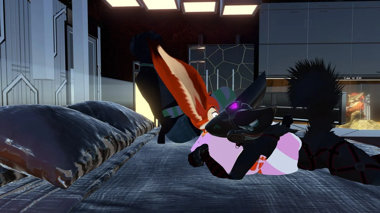 A digital illustration of two anthropomorphic characters on a modern bed in a room with futuristic decor. One character has large fox-like ears and orange hair, and is lying on their stomach. The other character has spiky black hair and is propped up