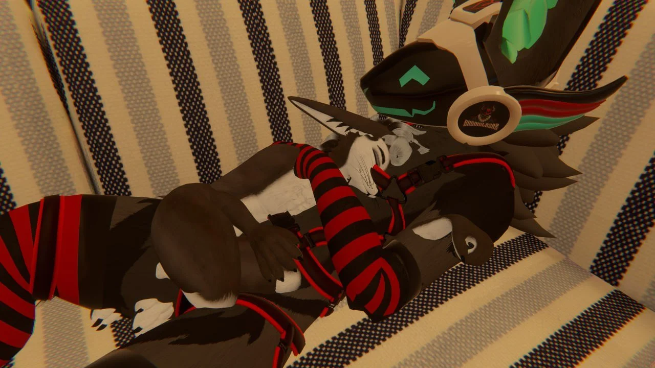 A close-up of a person wearing a robotic dog mask and a Red Dead Redemption-themed sweater, lying on a striped fabric surface.