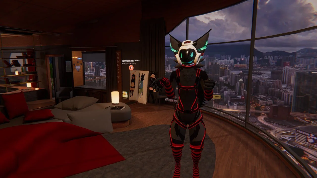 A virtual character in a black and red futuristic suit with a helmet and glowing eyes standing in a modern high-rise apartment with large windows overlooking a cityscape at dusk.