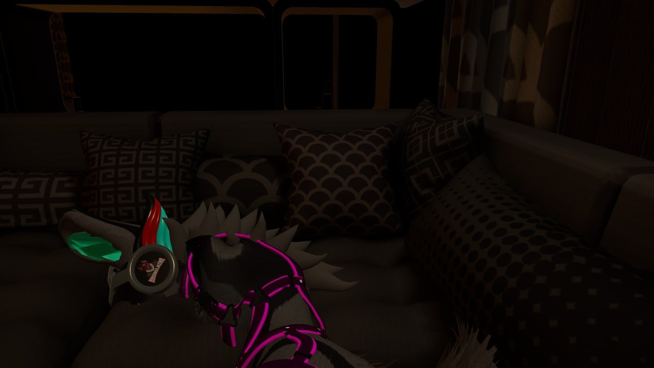 A dark room with a couch featuring multiple patterned cushions and a plush Spike the Dinosaur toy from Fortnite with glow-in-the-dark accents.