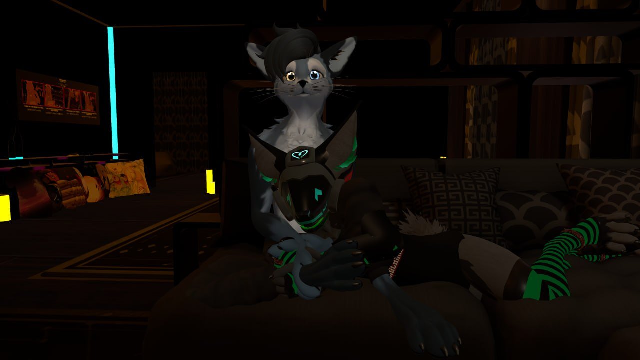 A digital cartoon-style anthropomorphic feline character with gray and white fur, large expressive eyes, and black hair, sitting on a dark couch in a dimly lit room. The character is wearing futuristic armor with neon green and black accents, striped