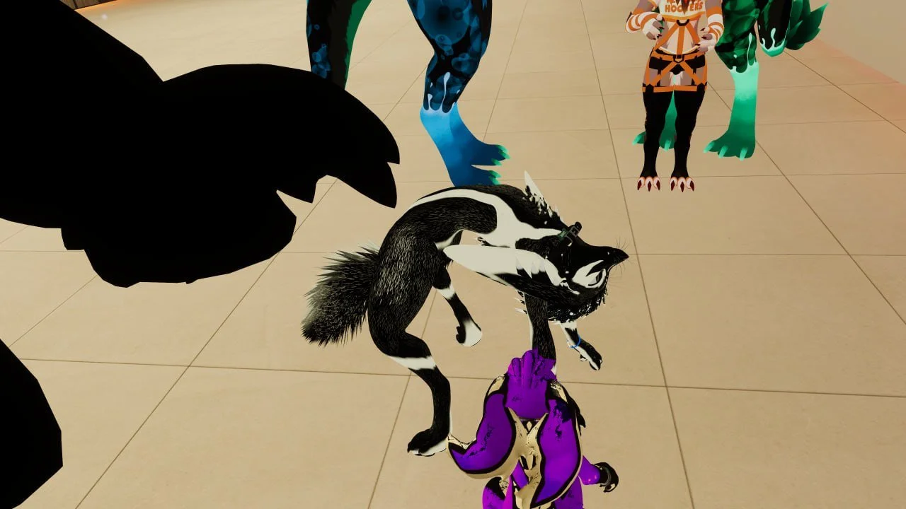Group of people dressed in dinosaur and dragon costumes standing on a tiled floor.