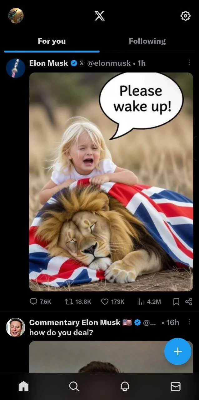 A young girl with blonde hair crying and saying, 'Please wake up,' while lying on top of a sleeping lion wrapped in a Union Jack flag.