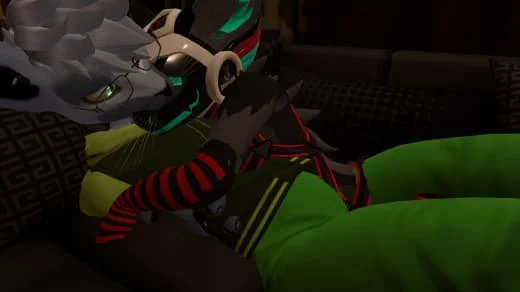 Child lying on a couch surrounded by gaming controllers, wearing green pants and a striped long-sleeve shirt.