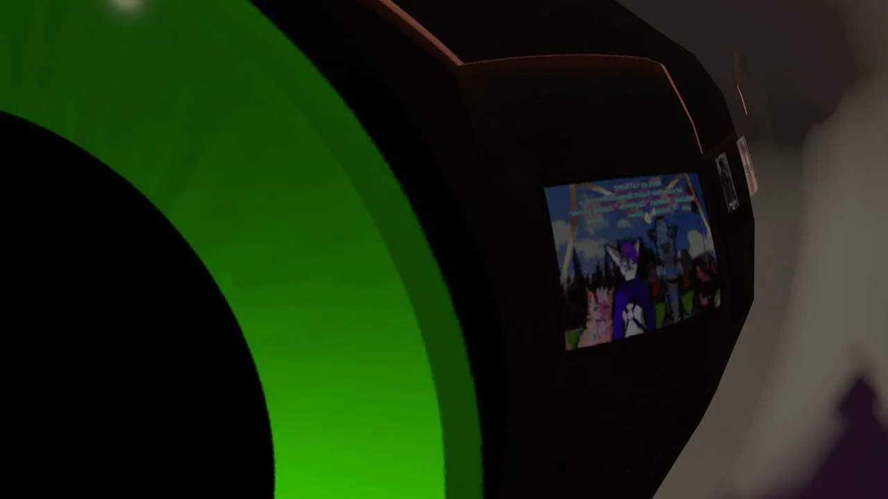 Close-up of a gaming console or equipment, with a small screen displaying an animated or cartoon scene with three characters outdoors.