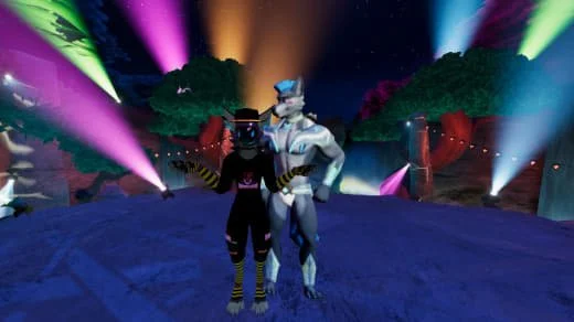 Two characters in costumes standing in a colorful, illuminated outdoor setting with trees and bright lights.