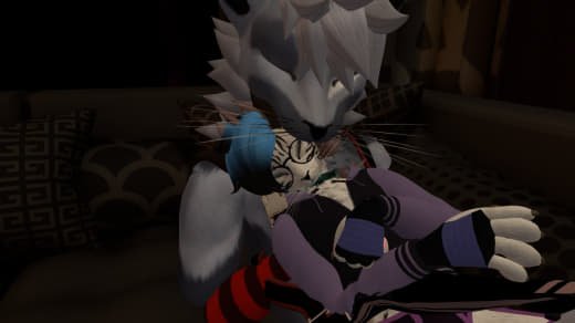 An anthropomorphic wolf with spiky fur hugging a small cat. The scene appears to be indoors on a dark-colored bed or couch.
