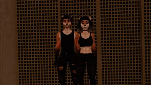 Two people wearing animal masks and black clothing, standing in front of a wooden lattice wall.
