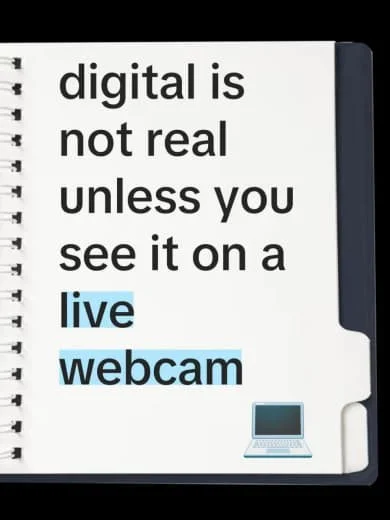 Notebook page with text stating 'digital is not real unless you see it on a live webcam' and an icon of a laptop.