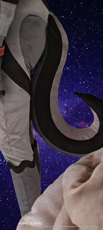Astronaut in a spacesuit floating in space with a starry background.