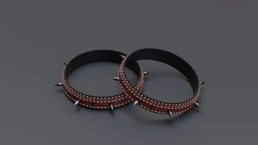 Two black and brown leather bracelets with metal spikes, displayed on a gray surface.