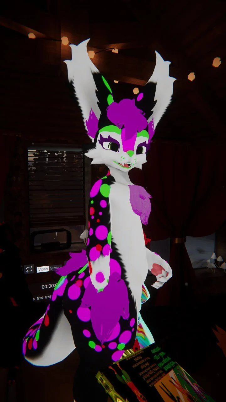 Digital illustration of an anthropomorphic feline character with large ears, vibrant purple and neon green markings, and a multicolored fur pattern.