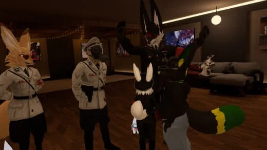 People in costumes, including a rabbit, a fox, and a dark character with a large head, in a dimly lit room with decorations and a couch.