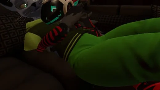 Person lying on a bed with green sheets, wearing black glasses and headphones, and a red-and-black striped shirt.