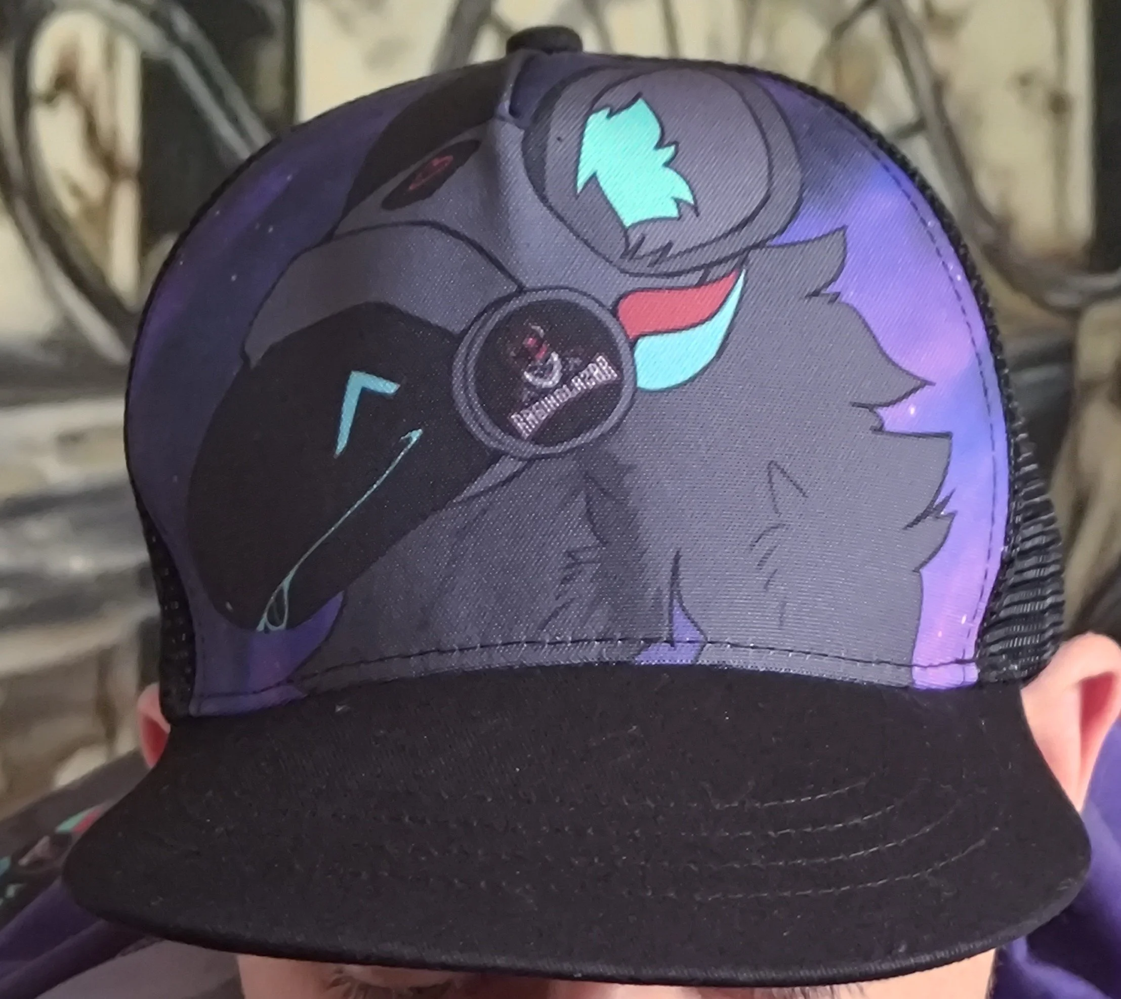 A person wearing a baseball cap with a pony design on it, showing the back of their head.