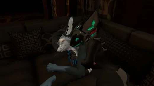 A person dressed in a robot or cyberpunk costume, sitting on a couch in a dimly lit room.