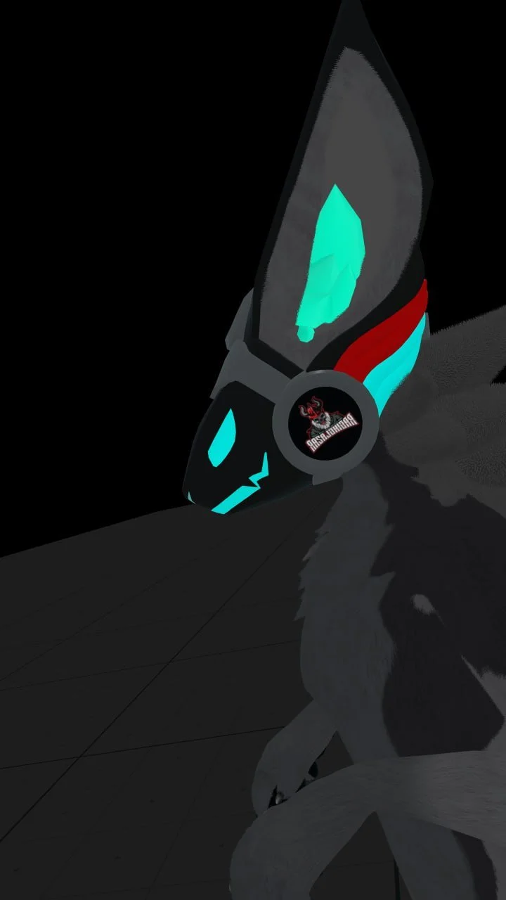A black and gray gaming mouse with blue and red accents, featuring a circular logo with a red and black design, placed on a black surface. Part of a gray furry animal, possibly a dog or wolf, is visible in the foreground.