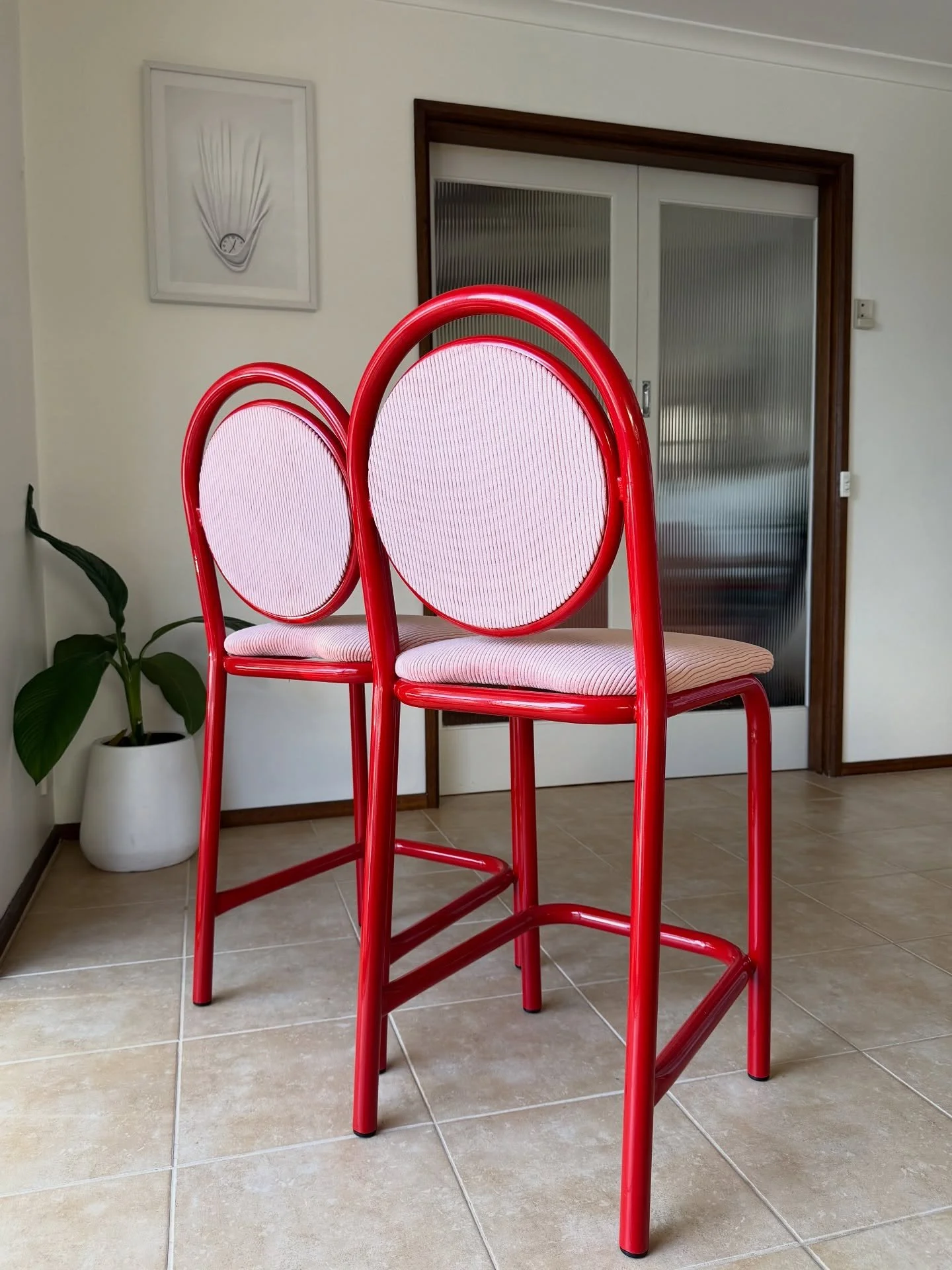 SOLD - 2x Pink/Red Circle Back Stools. 

Bright red powder coated frames with hints of Memphis design with the cute circle detail on the backrest, paired with the soft pink corduroy upholstery. 

Dimensions: 
440w x 520d x 1050h. 
630 seat height.