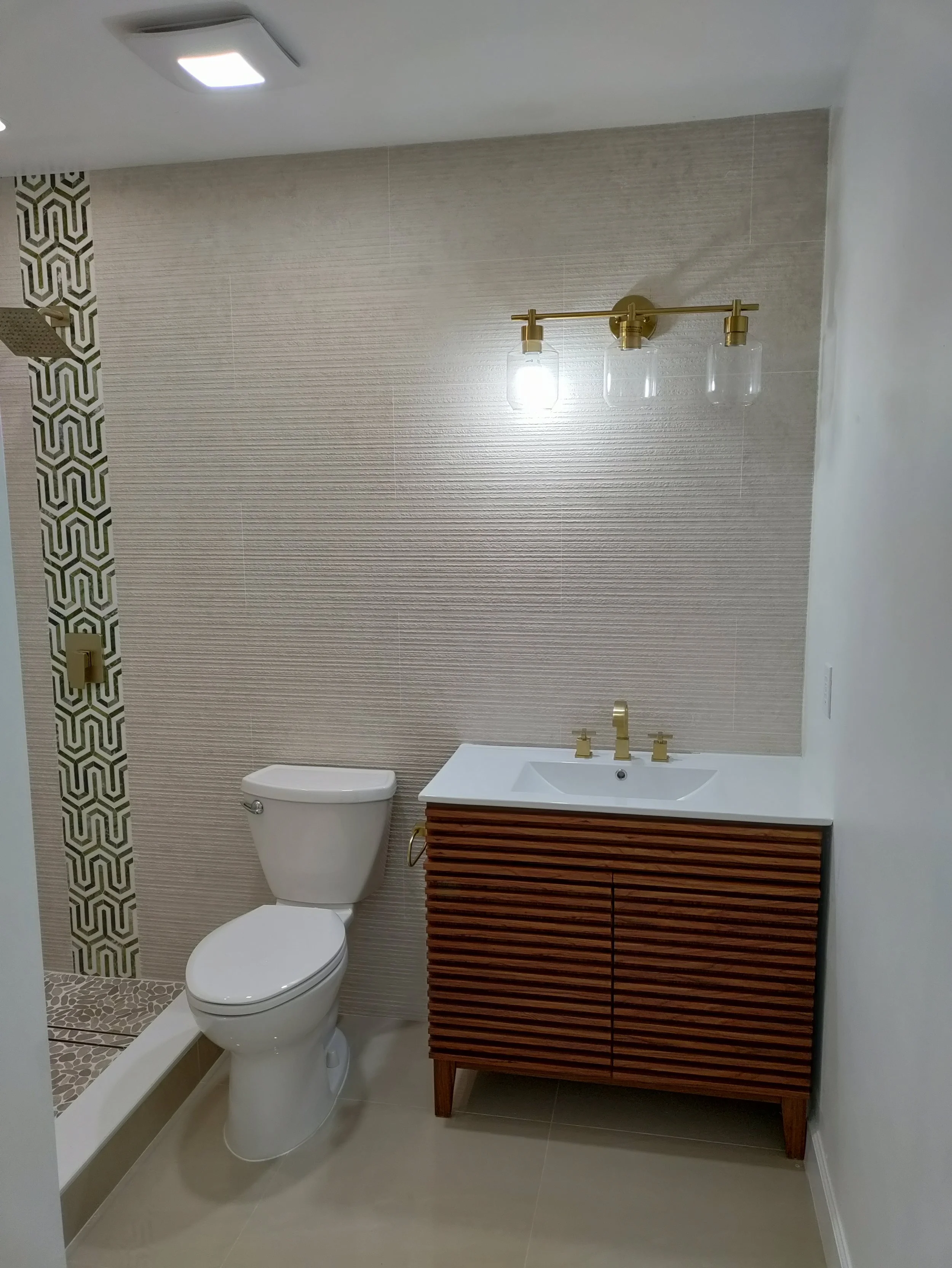 Modern walk-in shower and vanity installation