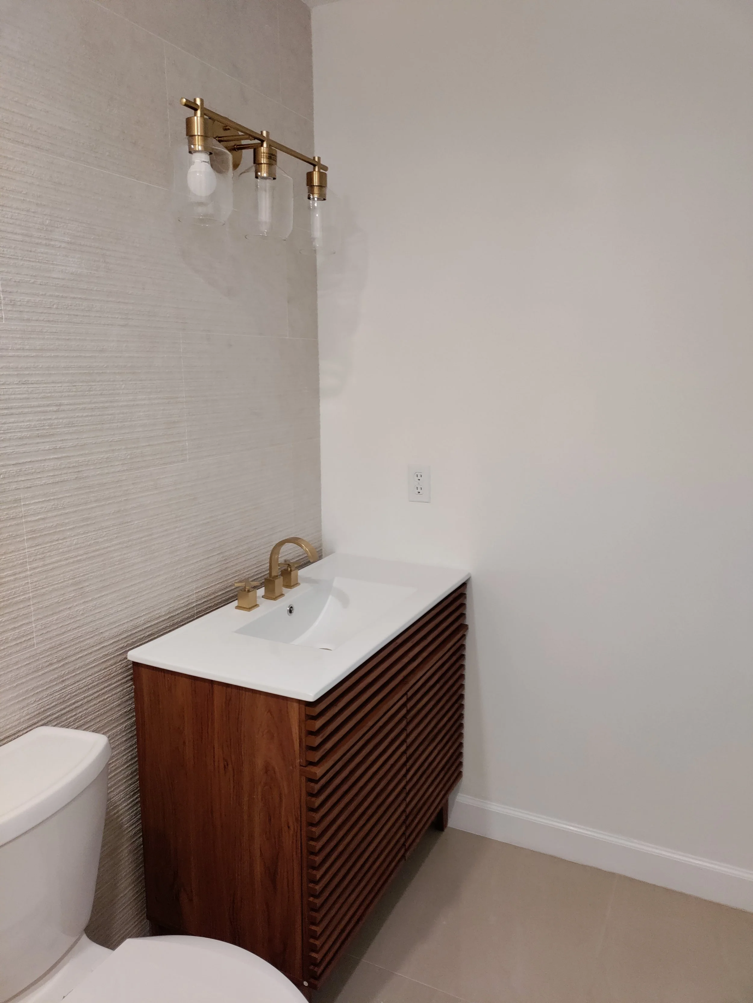Modern walk-in shower and vanity installation