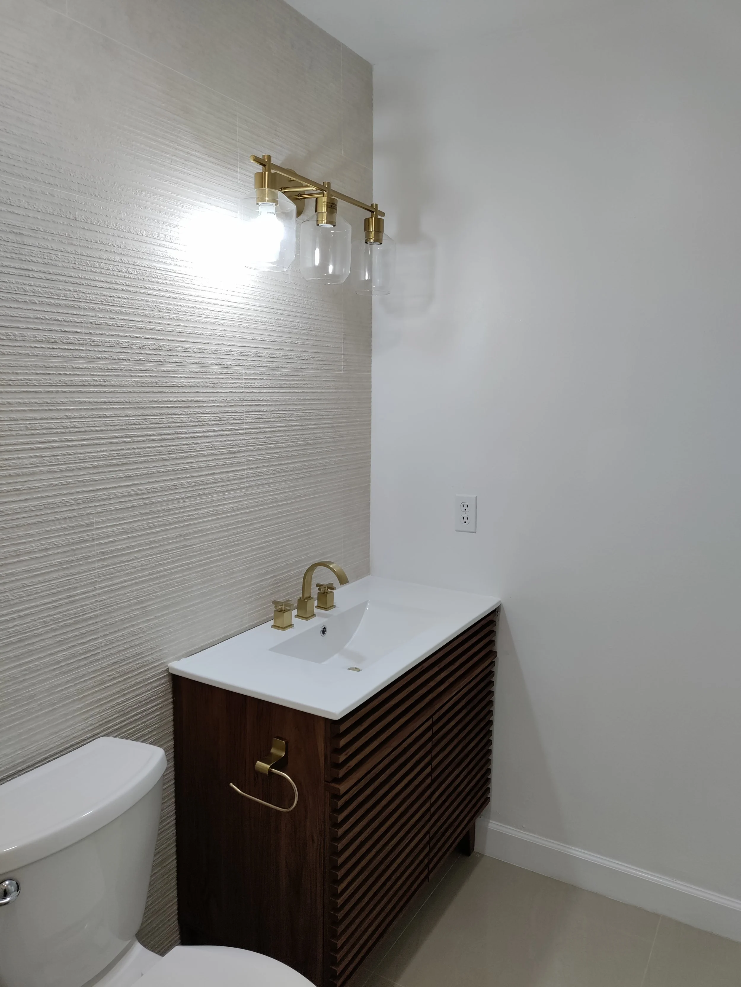 Modern walk-in shower and vanity installation