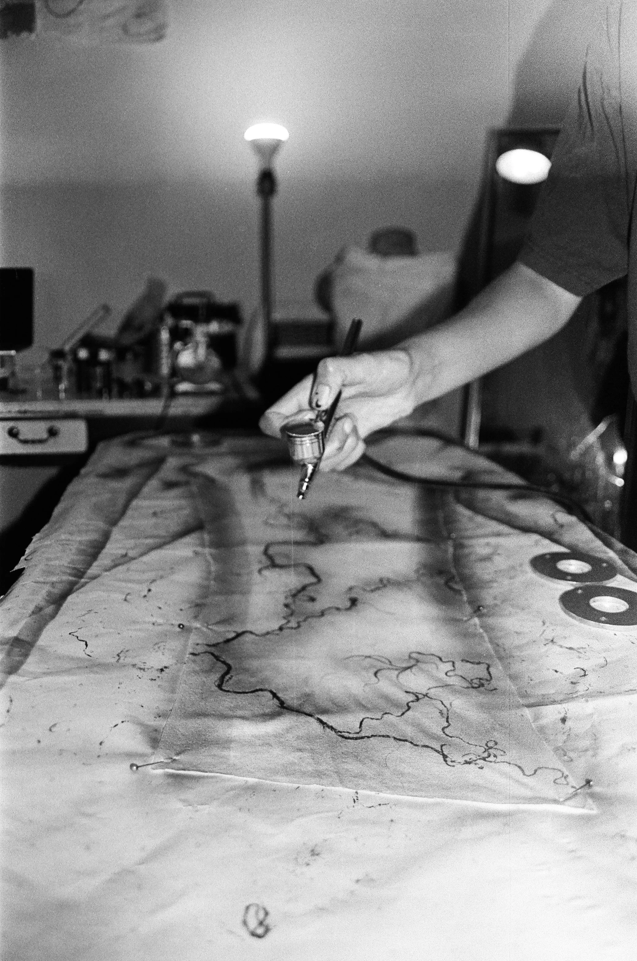 Gurleen Home Studio, airbrushing custom garments for N*S*F*W techno collective, New Orleans 2026