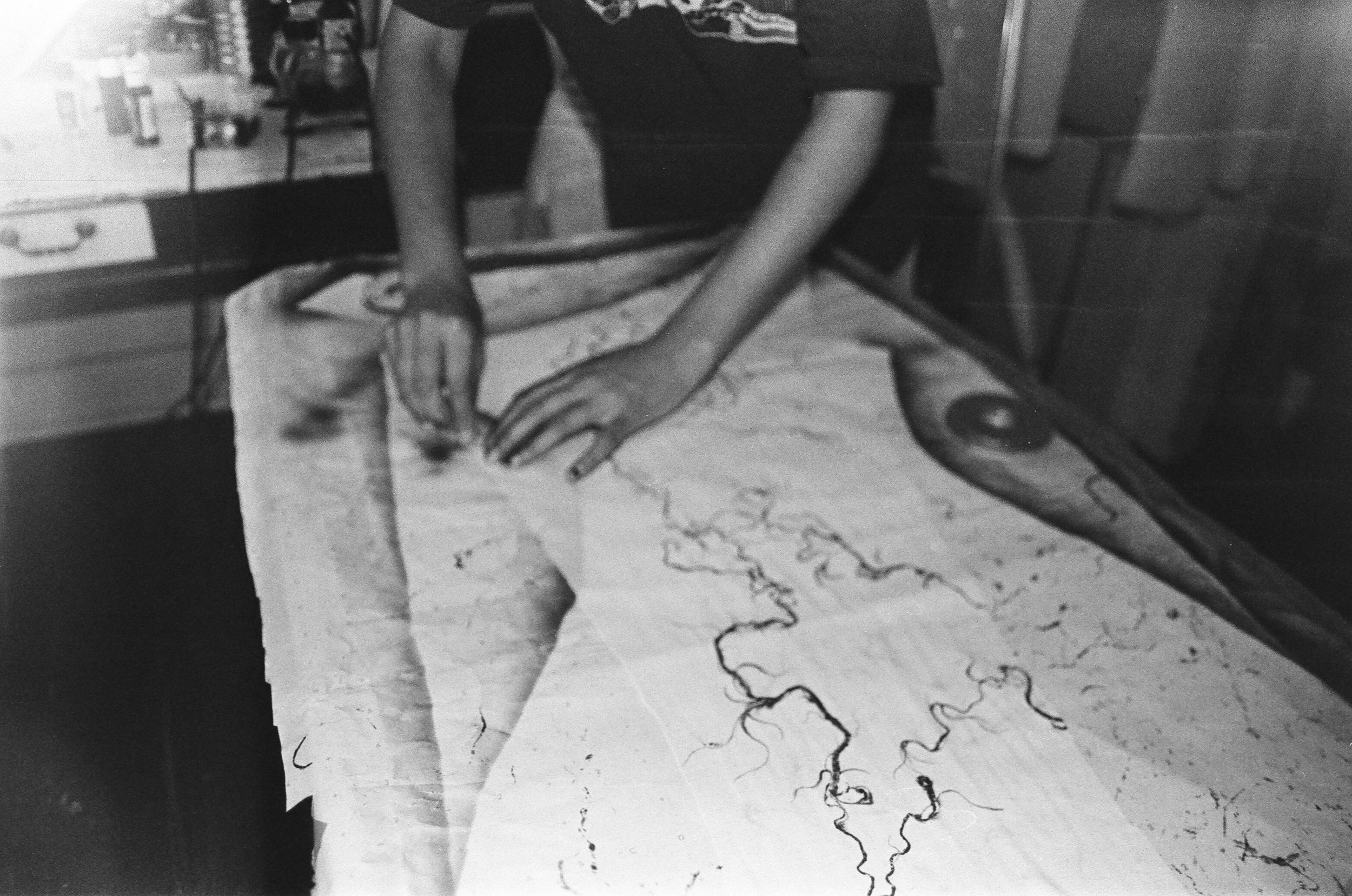 Gurleen Home Studio, airbrushing custom garments for N*S*F*W techno collective, New Orleans 2026