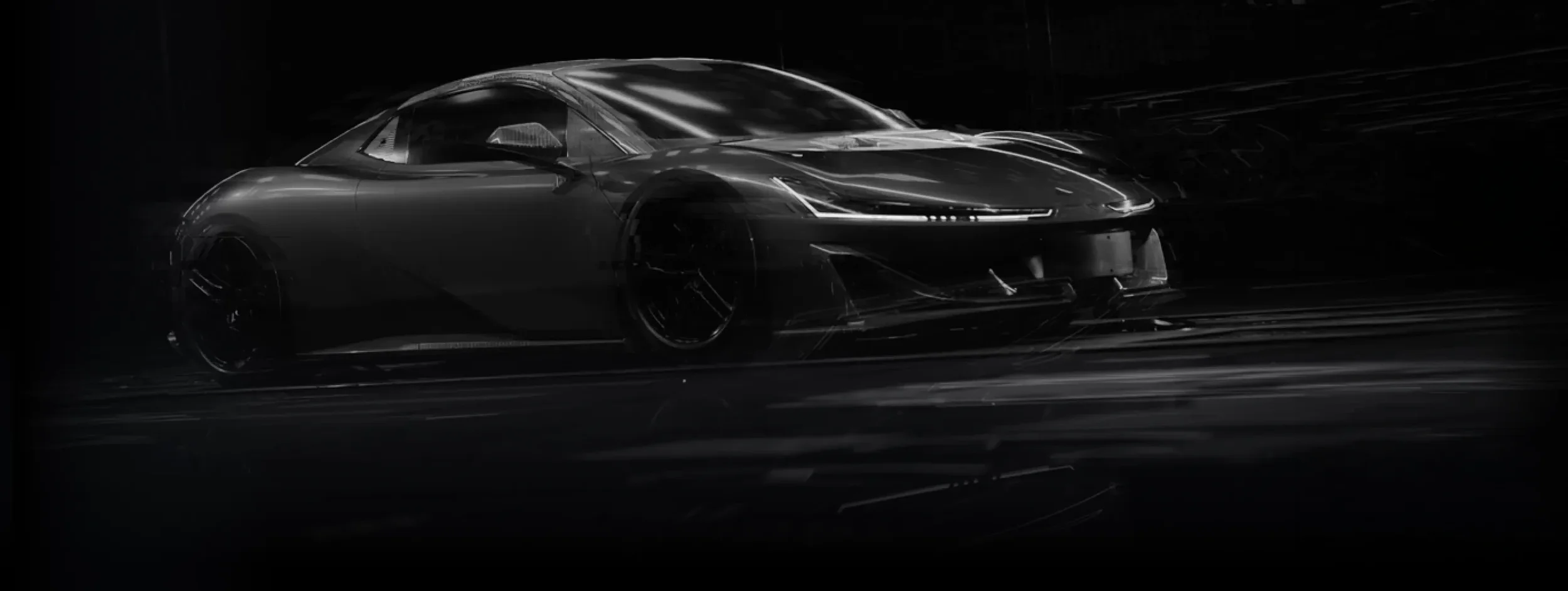 A black sports car with sleek design, shown in a dark setting with reflections on its surface.