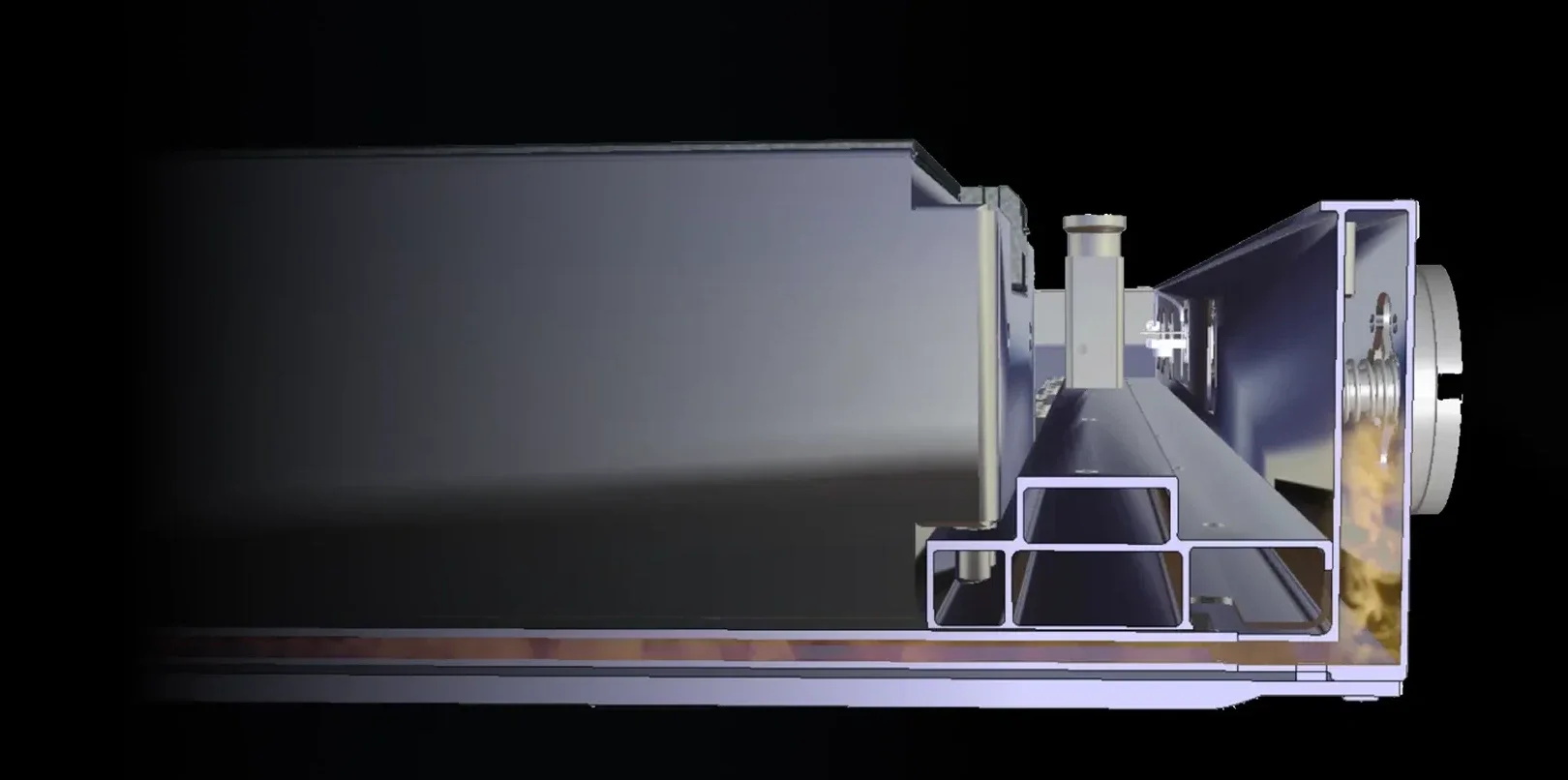 A close-up view of a metallic industrial machine with a horizontal layout, showing internal components and structure.