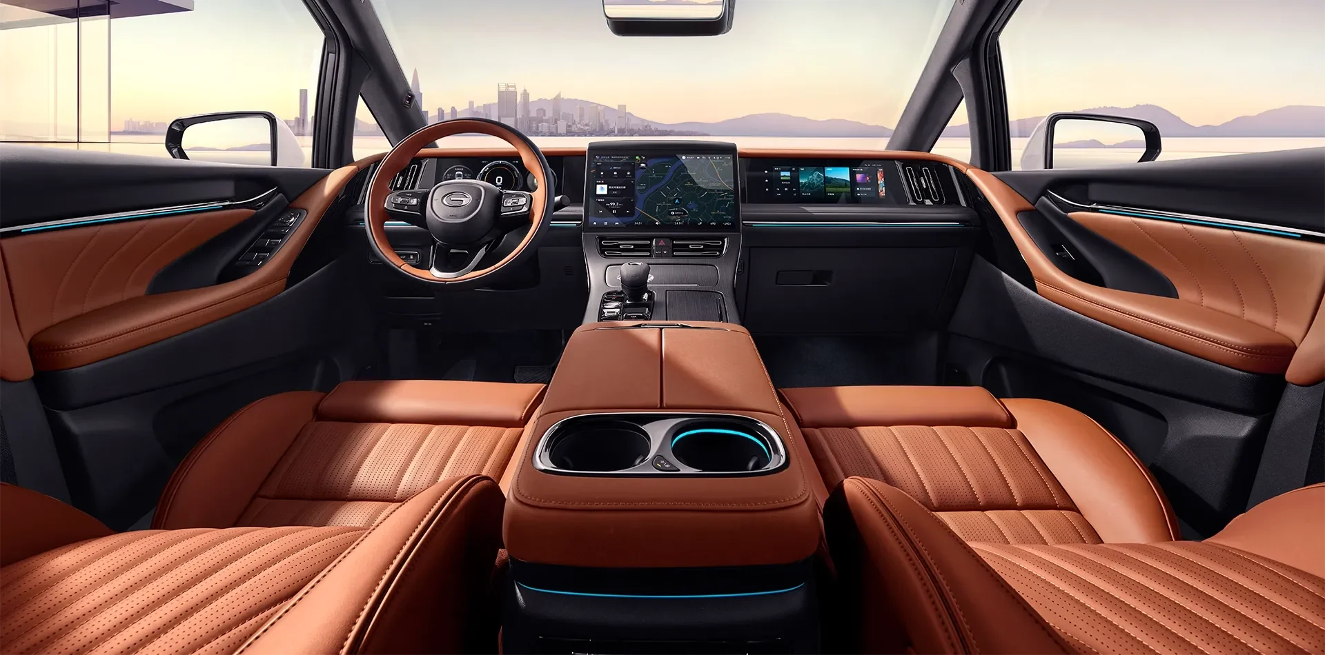 Interior of a modern luxury vehicle with brown leather seats, a digital dashboard, a large center touchscreen display, and panoramic windows showing a city skyline and mountains in the distance.