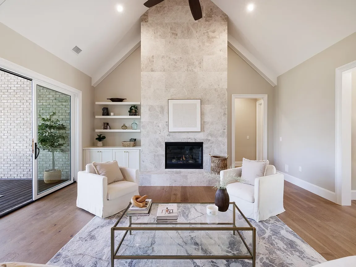 Light and airy living room professionally staged by VIBE Designs in Greenville, SC.