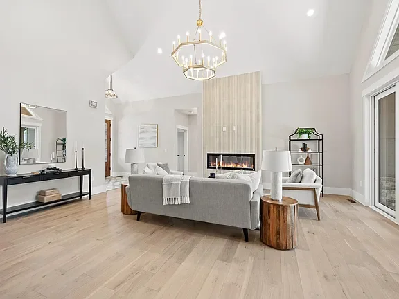 Modern, bright living room professionally staged by VIBE Designs in Greenville, SC.