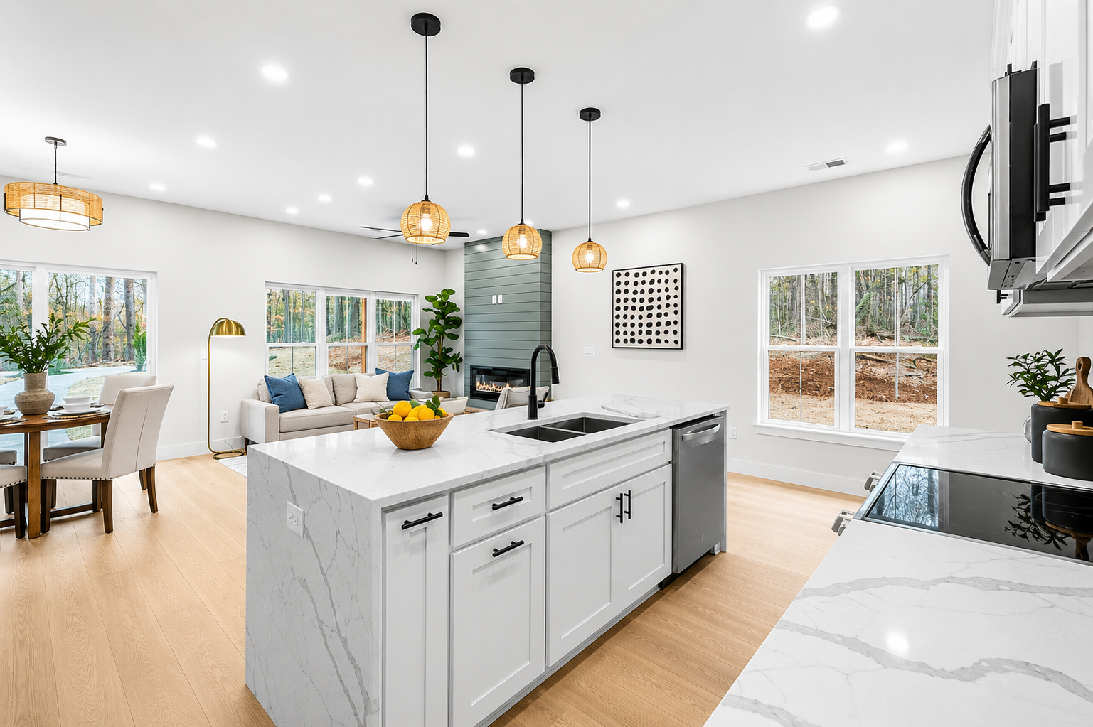Modern open-concept kitchen and living room, professionally staged by VIBE Designs in Greenville, SC.