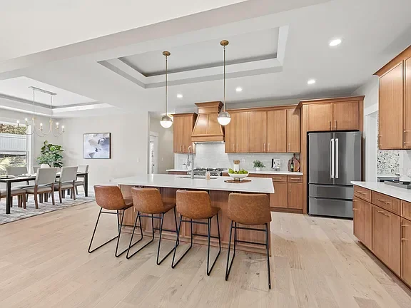 Open-concept kitchen with a large island, professionally staged by VIBE Designs in Greenville, SC.