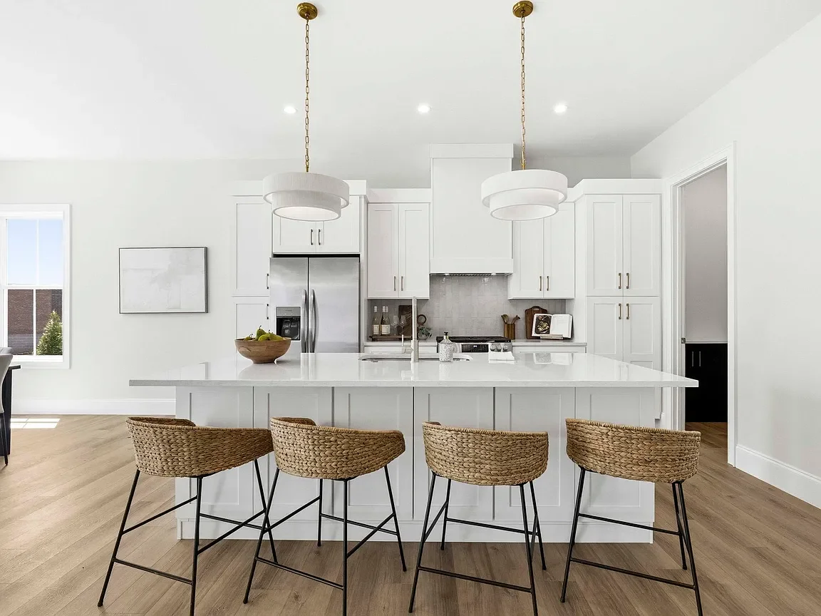 Modern white kitchen professionally staged by VIBE Designs in Greenville, SC.