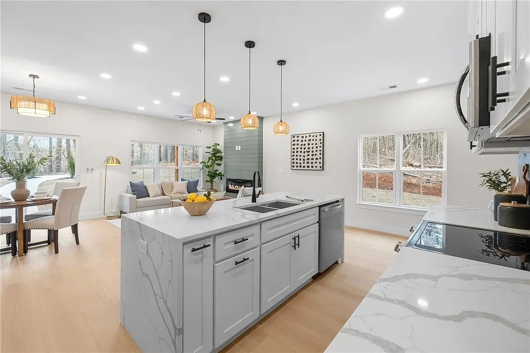 Modern open-concept kitchen professionally staged by VIBE Designs in Greenville, SC.