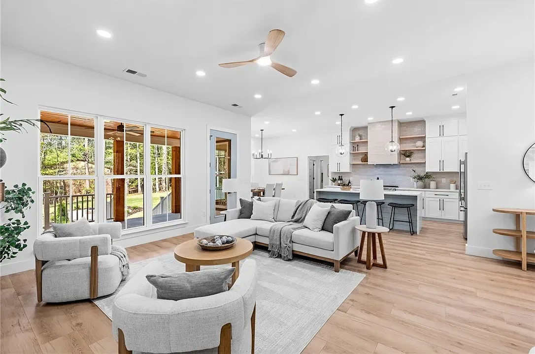 Open-concept living room and kitchen professionally staged by VIBE Designs in Greenville, SC.