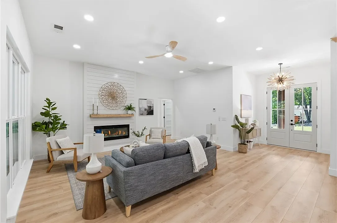 Modern, bright living room professionally staged by VIBE Designs in Greenville, SC.