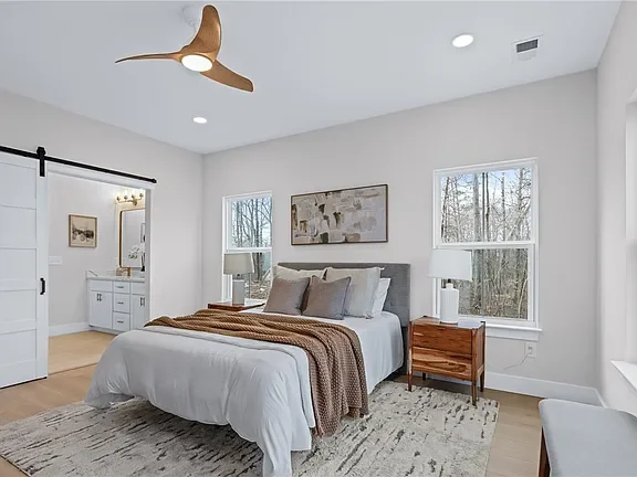 Dreamy bedroom professionally staged by VIBE Designs in Greenville, SC.