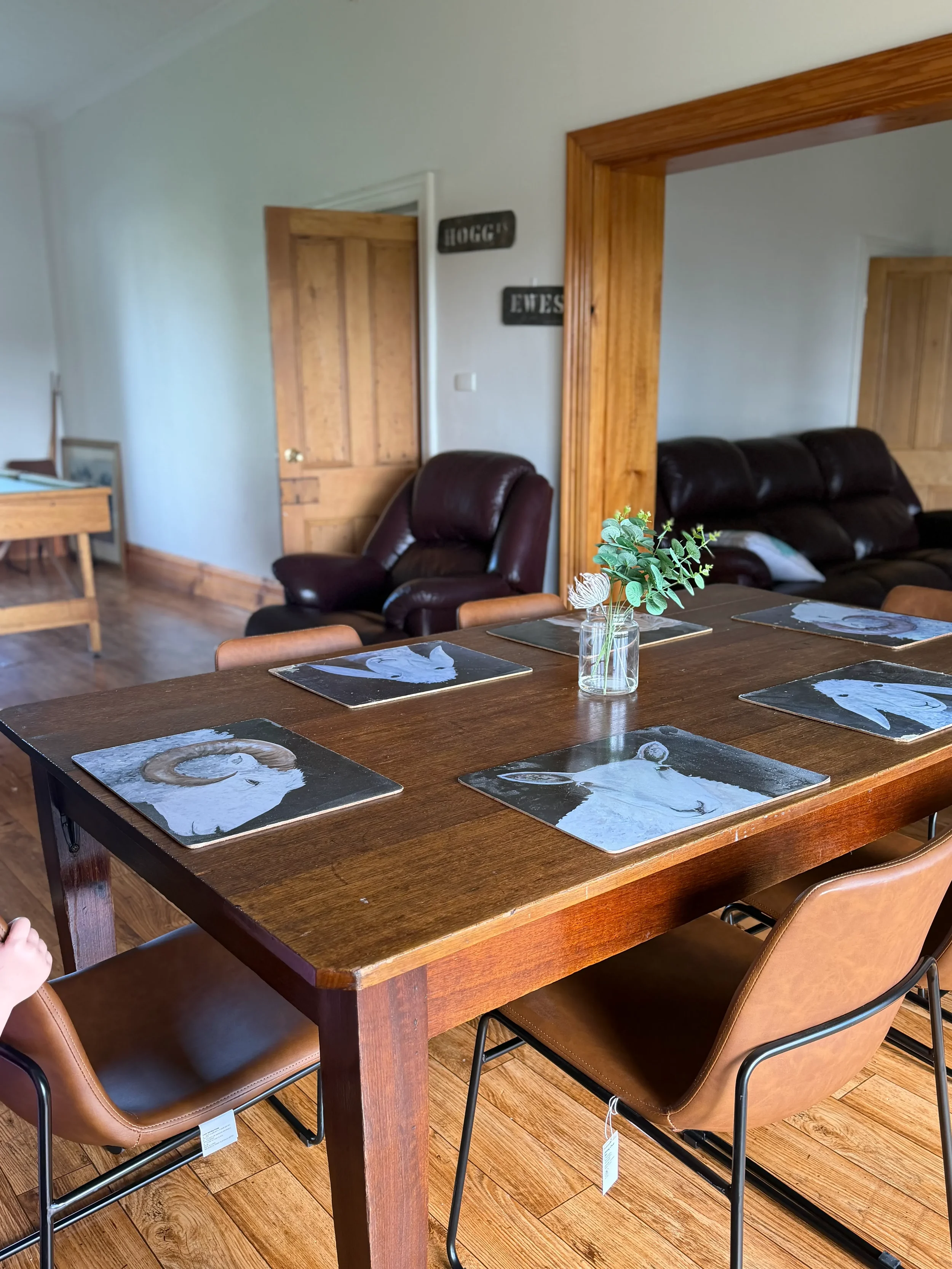 Dining and living area at The Original Homestead, with its playful "Hogg" and "Ewes" room signage — group accommodation Tatiara, sleeps up to ten.