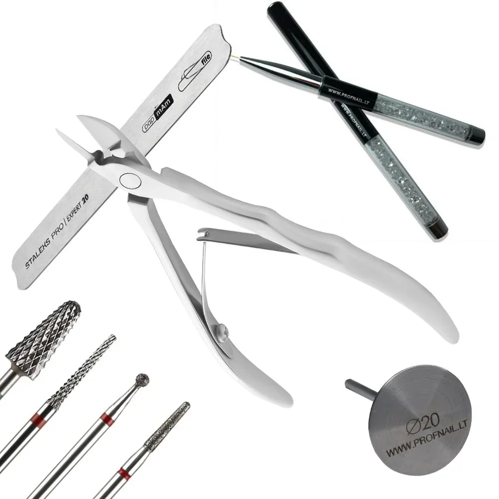 Set of manicure or pedicure tools including nail clippers, scissors, files, and other professional-grade instruments.