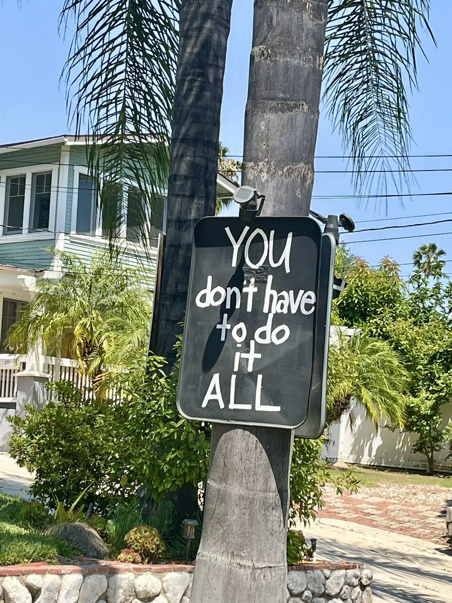 A picture of a homemade sign saying "You don't have to do it all"