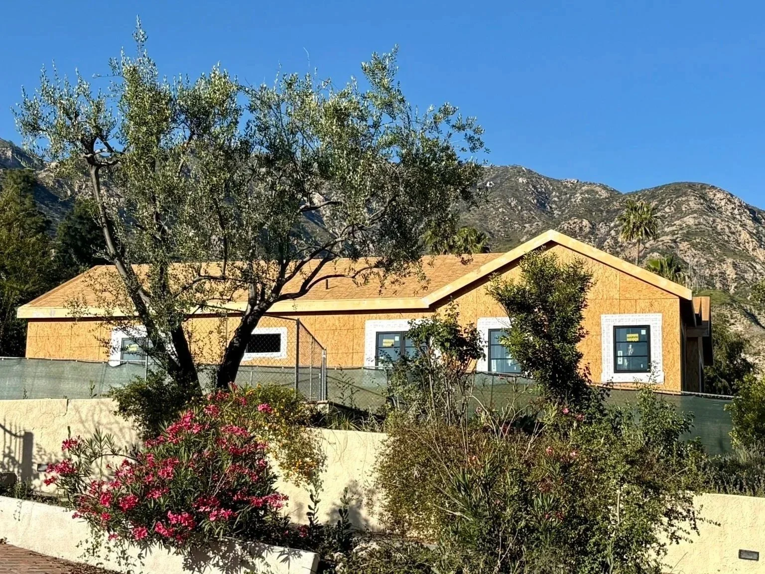 A picture of a partially rebuilt house