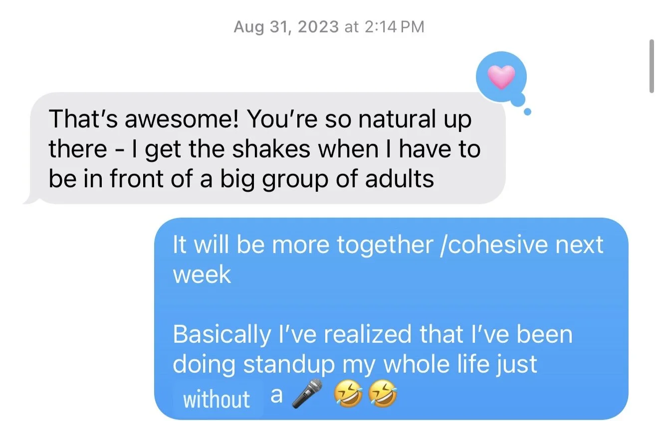 Text conversation discussing public speaking, with one person expressing admiration and the other joking about performing stand-up comedy without a microphone.