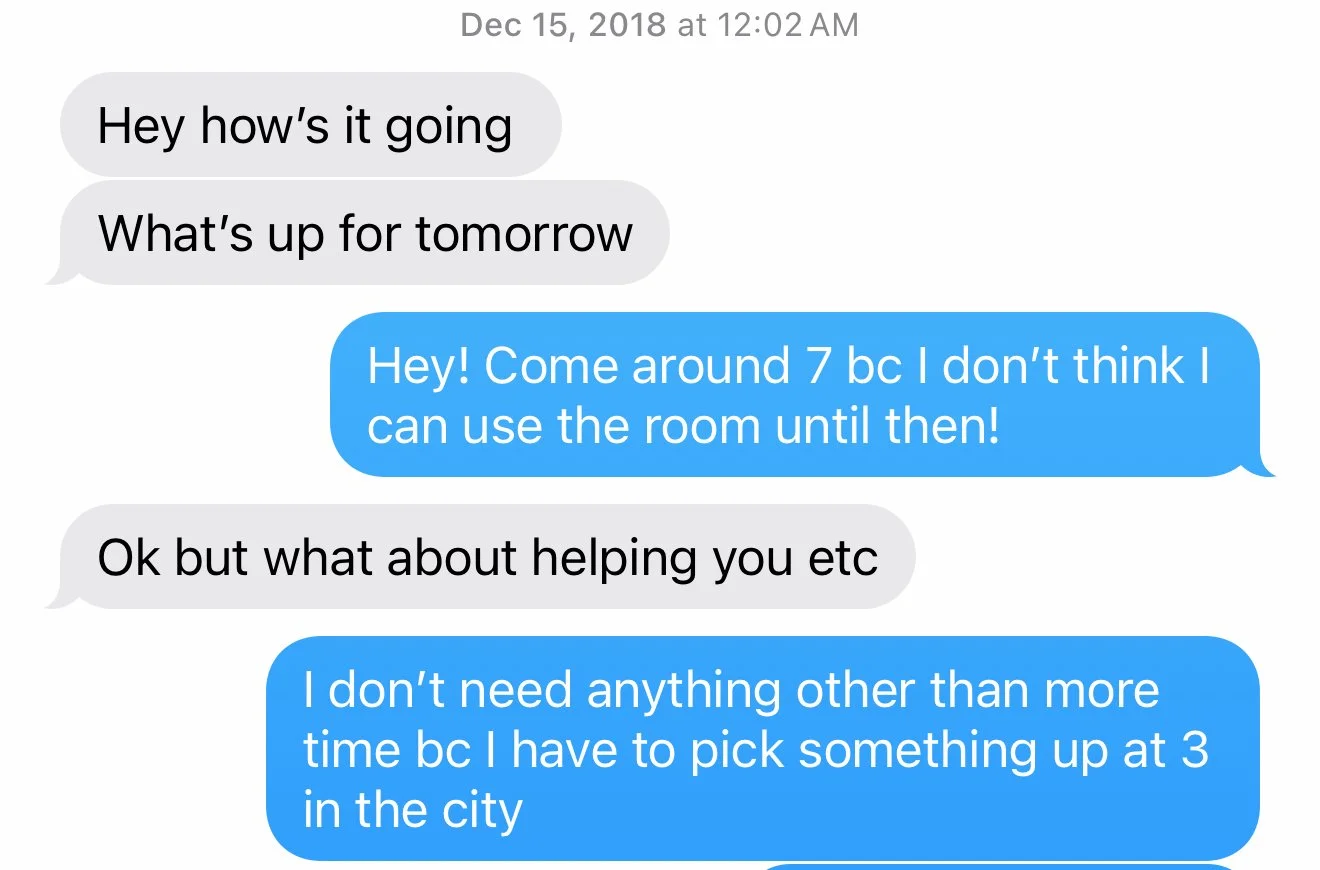 A text message conversation from December 15, 2018, at 12:02 AM. One person asks how it's going and what's up for tomorrow. The other responds with a suggestion to come around 7 PM because the room can't be used earlier. The first person offers to help, and the second person states they need more time due to picking something up at 3 in the city.