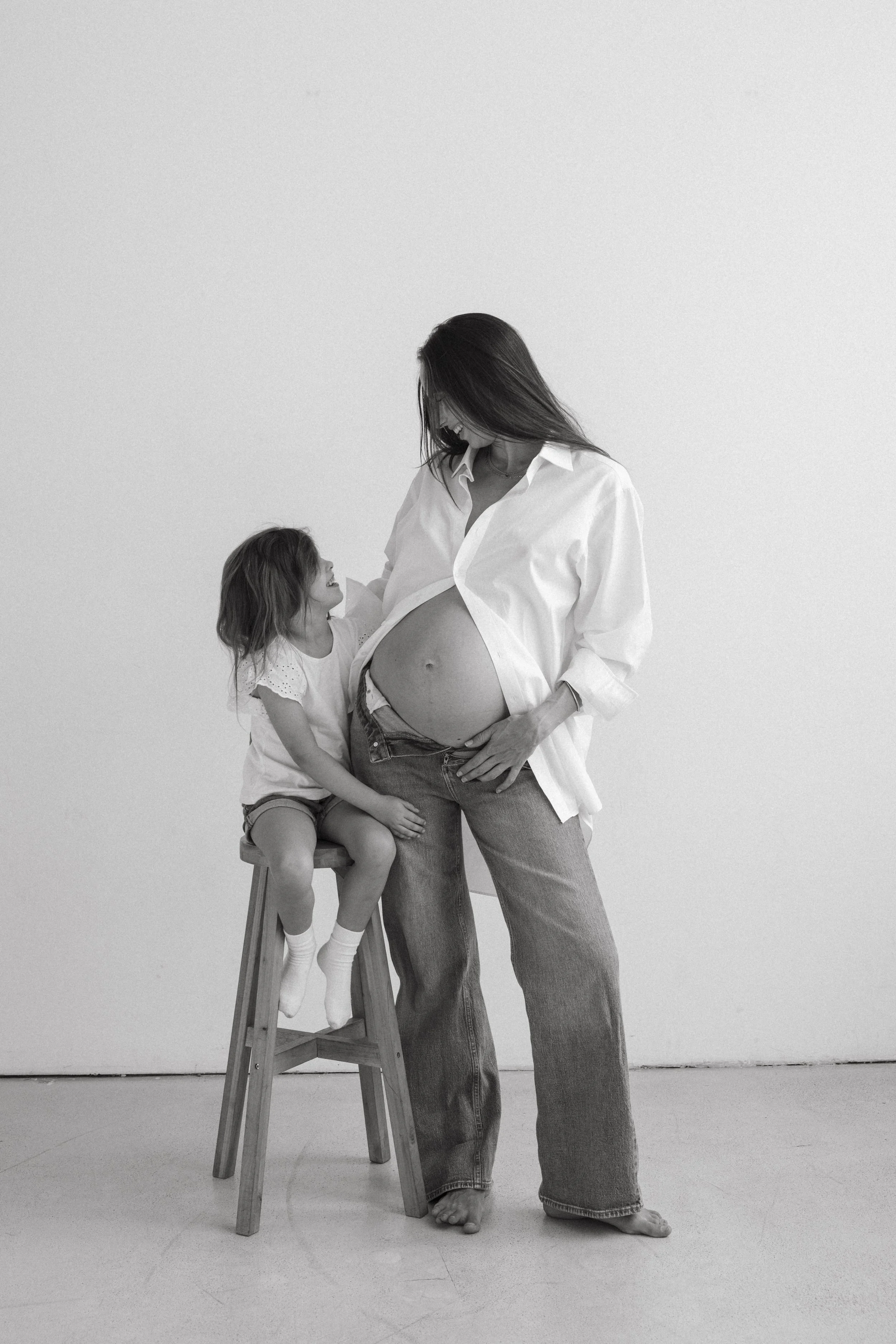 Black and White image of Tania Gnecchi with her daughter, motherhood and identity podcast