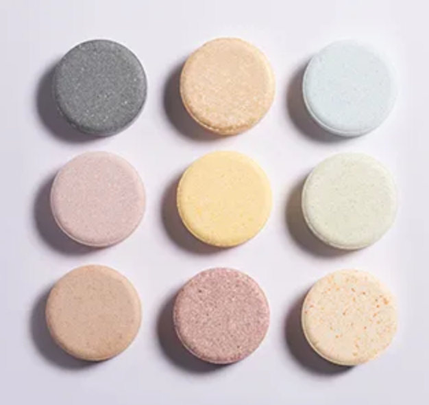Nine pastel-colored tablets arranged in a 3x3 grid on a white background.